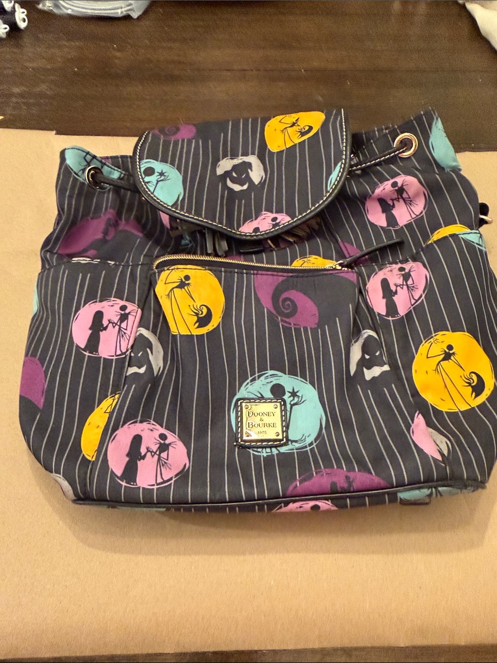 Dooney & Bourke Black Backpack with Yellow, Pink, Teal and Purple Accents